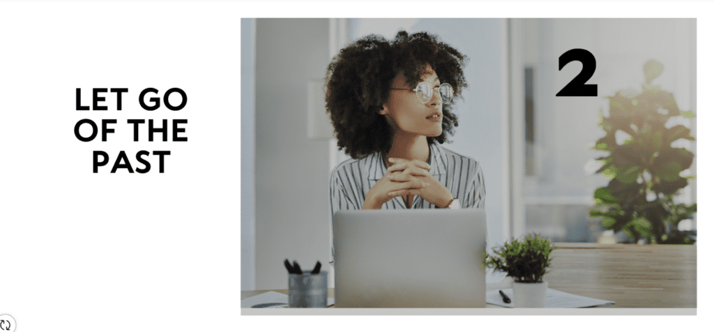 A woman sitting at her desk with a laptop.